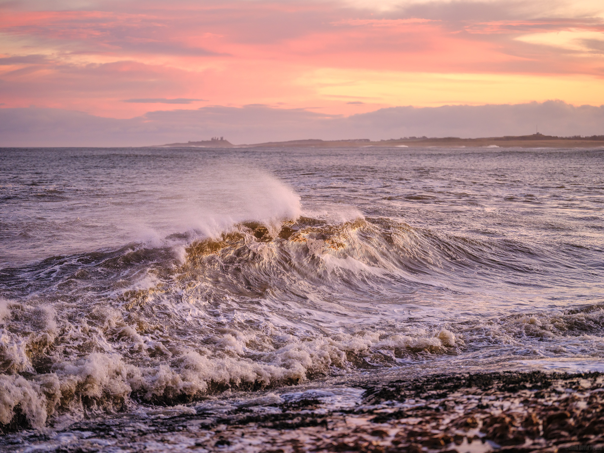 Dunstanburgh In The Distance