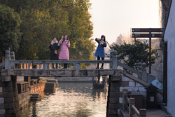 Tourists On A Bridge